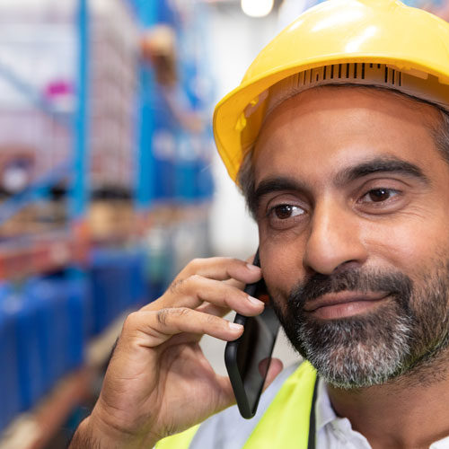 Man using phone to contact health and safety consultant